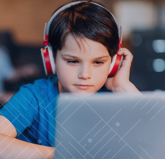 Boy with headphones in coding class