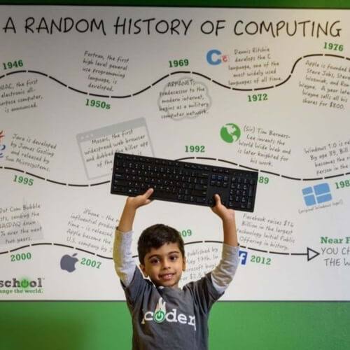 Kid holding keyboard