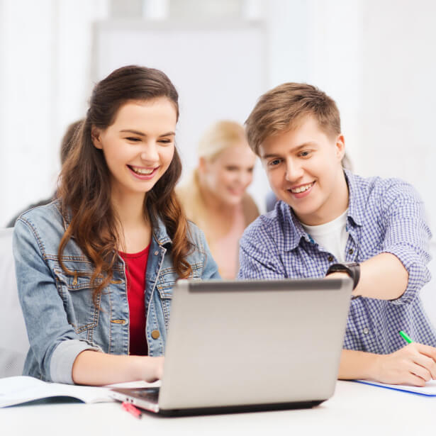 Two teens in coding class at school