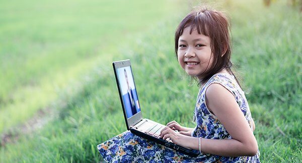 Girl participating in a virtual summer class.