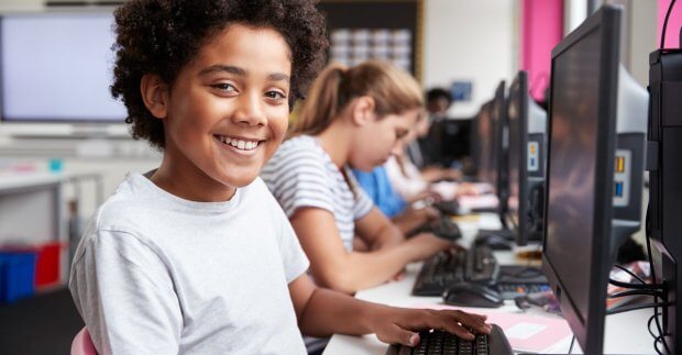 Smiling boy in computer lab