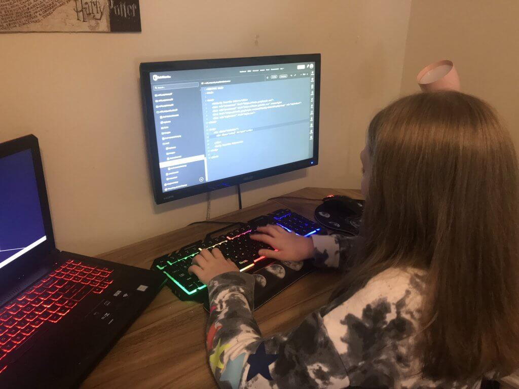 Sophie working on a CodeWizardsHQ coding project