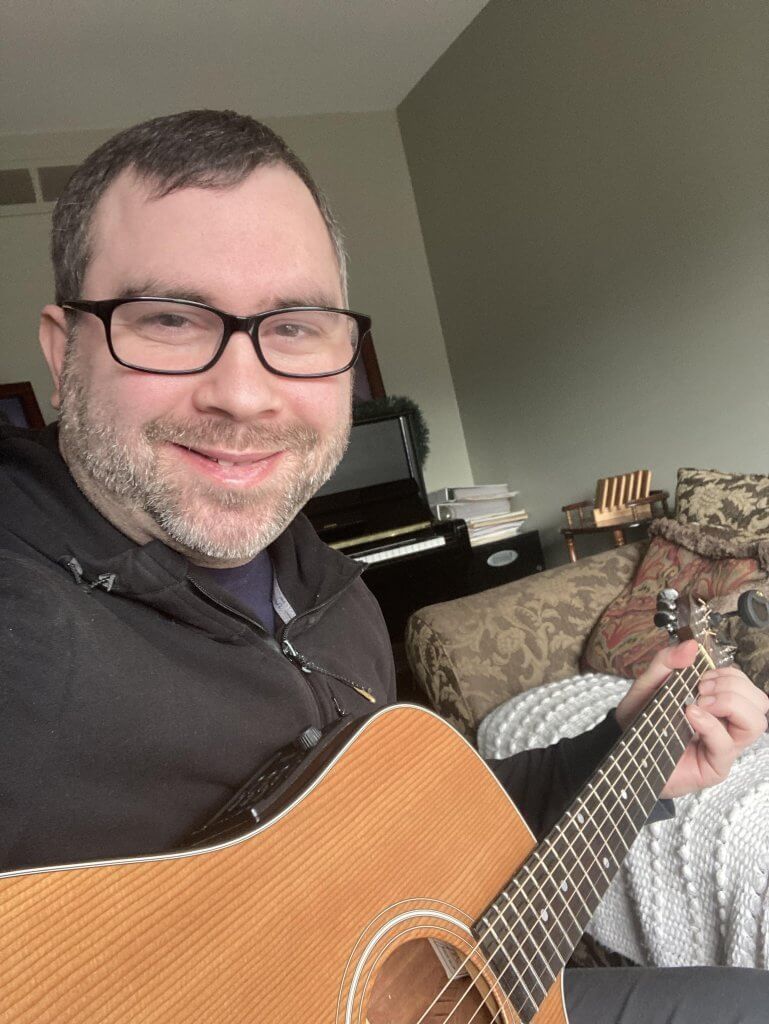 Aaron with guitar