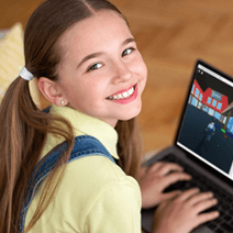 Elementary age girl on the computer in coding class